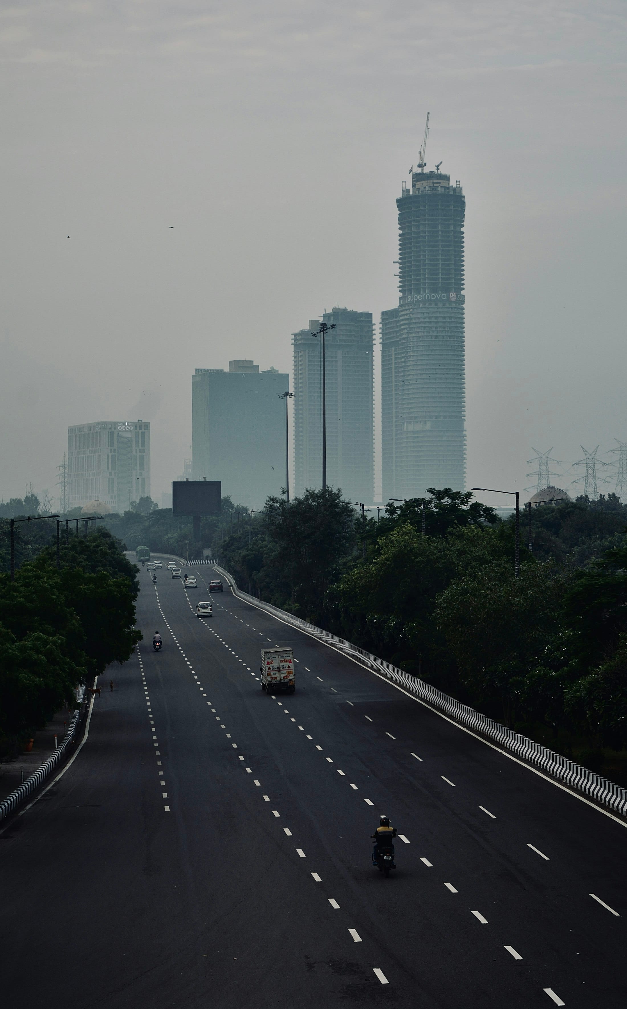 The Noida–Greater Noida Expressway running past high-rise towers in Noida