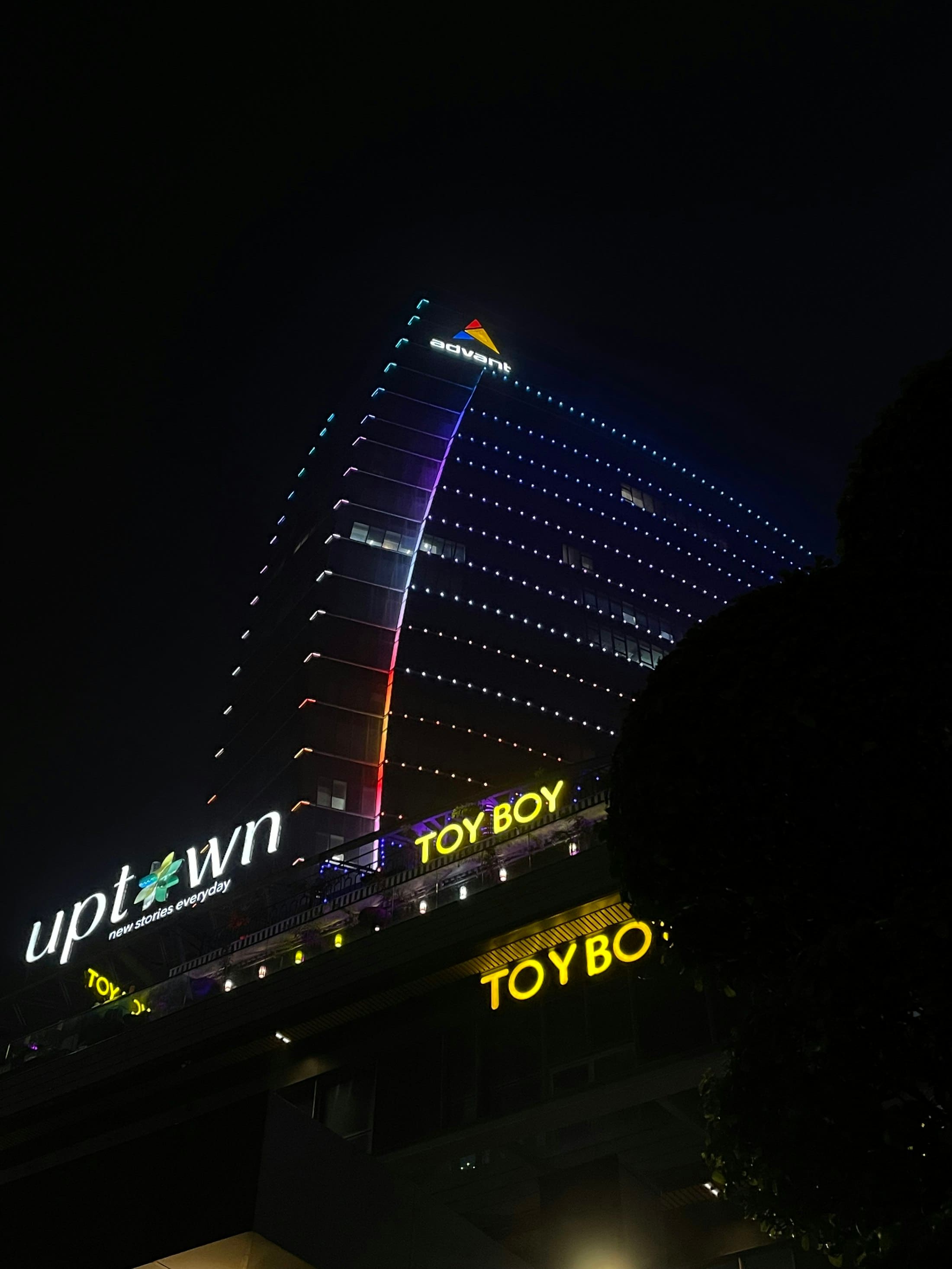 A commercial building lit up at night in Noida