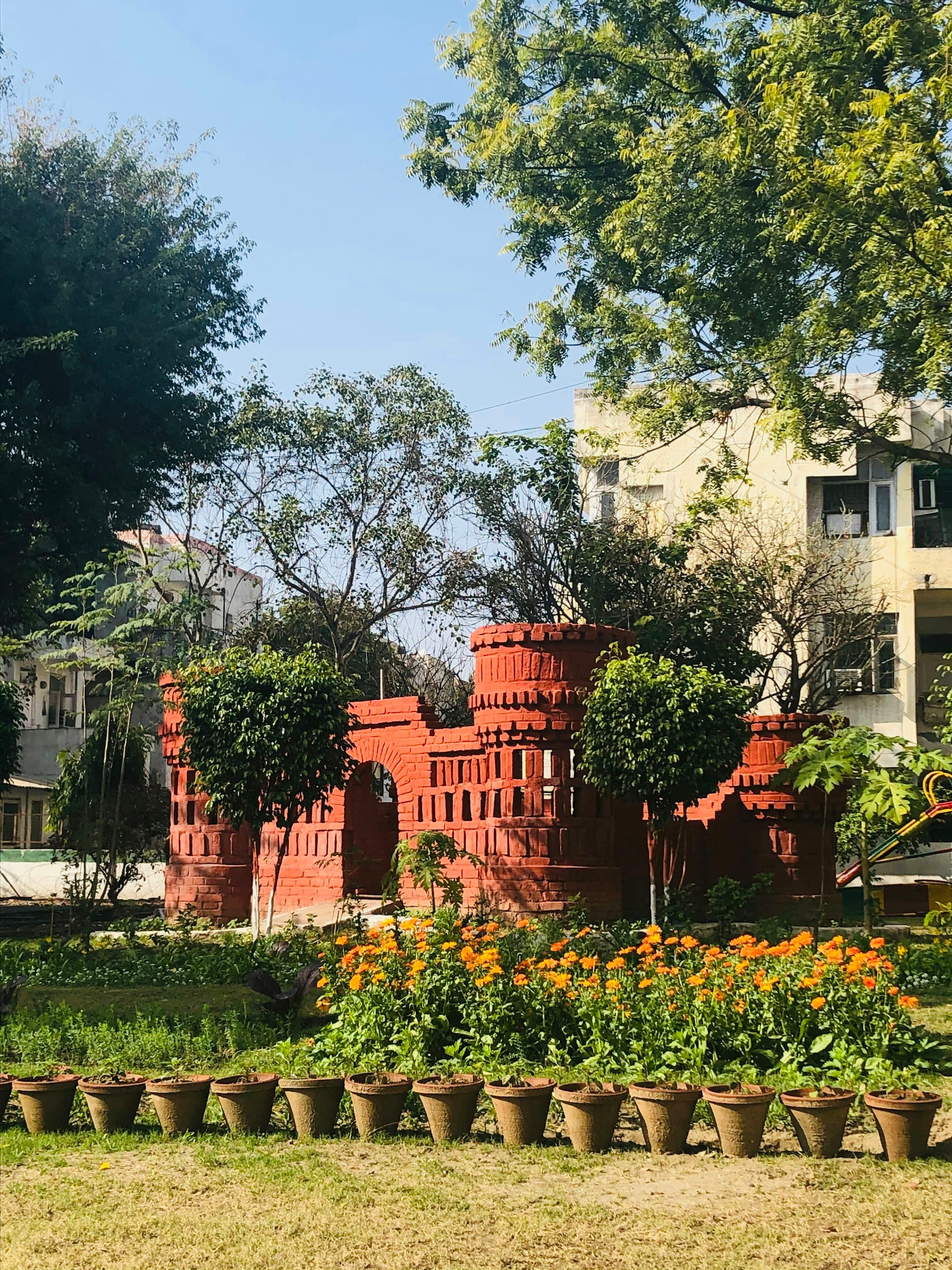 A red brick gateway in a park in Noida
